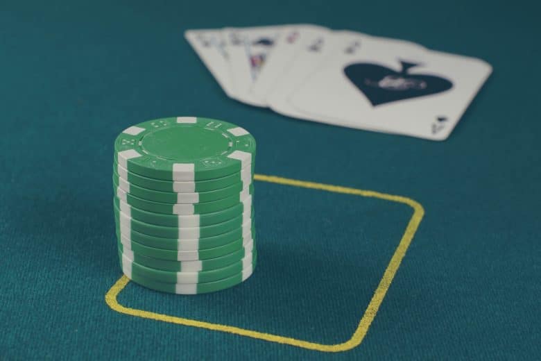 green poker chips on table